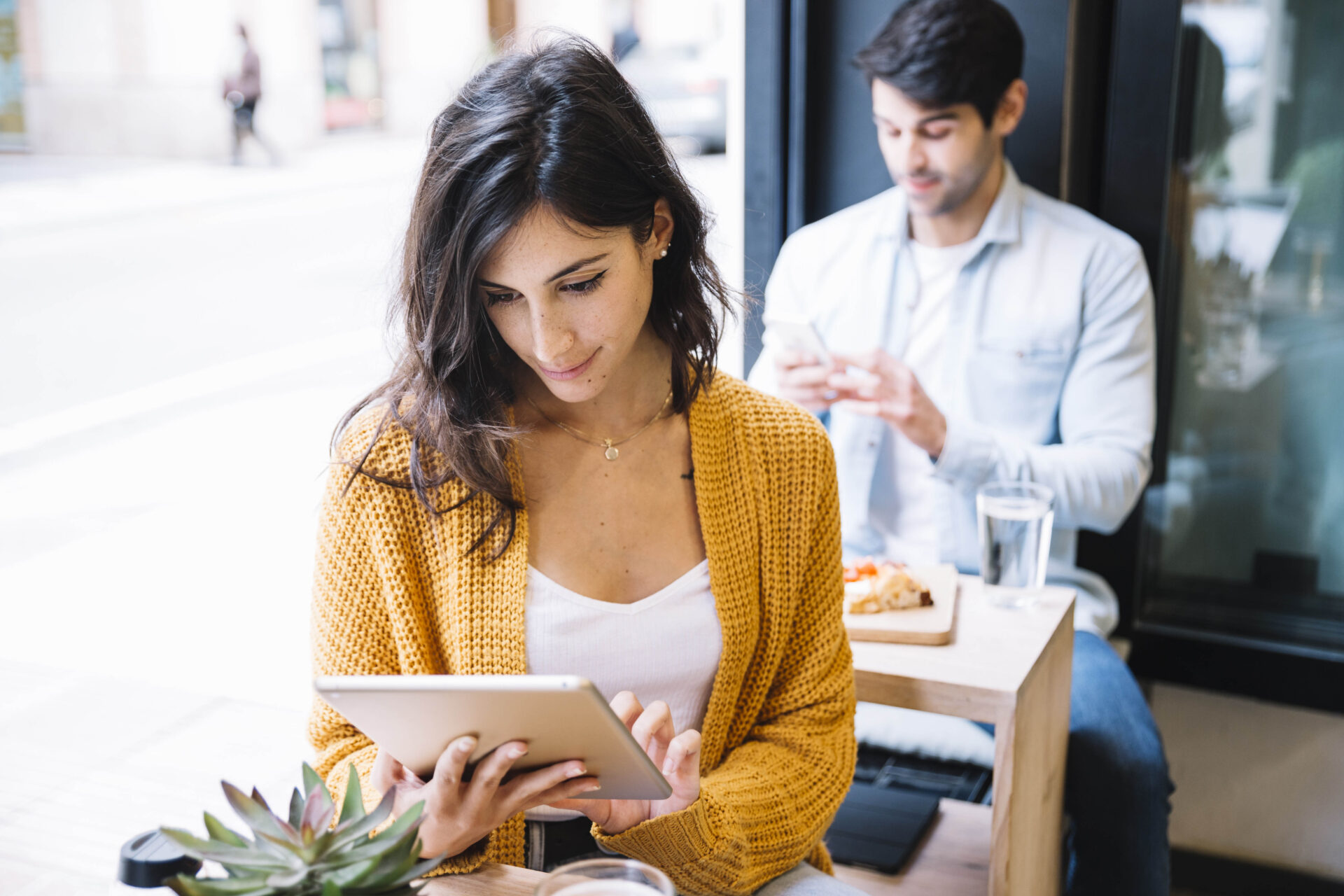 female cafe working tablet | ANG